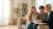 © Ada - Female Real Estate agent offers home ownership and life insurance to young couple. female financial advisor at home with large copy space, real estate and investment planning concept