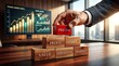 © resky - Executive hand building wooden block tower with red pricing top symbolizing financial market strategy and corporate profit