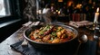 © BlackGraphicc - A steaming hot bowl of food with green herbs and red peppers sits on a wooden table in a dimly lit restaurant with people in the background