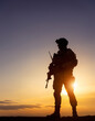 © Sri - Soldier Silhouette Standing Strong at Sunrise with a Rifle