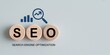 © Amena - The concept of SEO or Search Engine Optimization is shown with wooden blocks and icons