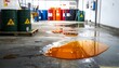 © Upnesh - Industrial scene showing oil spills on a concrete floor with barrels in the background.