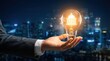 © Masque - Businessman holding a glowing creative light bulb with a digital networking and governance icon.