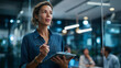 © Kateryna - Hands of businesswoman leading live business coaching session in modern glass wall office confident professional guiding colleagues through digital planning with notebook tools
