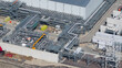 © AmazingAerialAgency - Drone view of Holland Hydrogen I on Tweede Maasvlakte, a major green hydrogen plant powered by offshore wind for sustainable industry and freight transport.