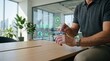 © Olivia - Businessman interacting with futuristic hologram interface displaying green tech, energy efficiency and carbon reduction charts in modern office environment for sustainable
