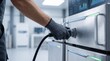 © Zoe - Technician plugging power cable into server rack, data center maintenance and it infrastructure support with gloved hand connecting electrical equipment for reliable network and