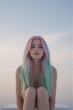 © Michael - A young woman with vibrant, multi-hued hair sits in serene contemplation on a sun-drenched outdoor patio, her neutral expression and subtle pose inviting introspection.
