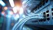 © Bonsales - Network cables plugging into a switch port, connecting hardware in a data center for digital information technology