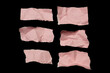 © M_Yunus - Pink torn or ripped paper scraps with various shape lie scattered isolated on black background.