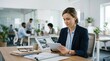 © spyrakot - Auto claims specialist reviewing case on digital tablet at modern office desk