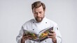© Aisha - Professional chef holding a recipe book, food photo on cover, looking down at book, front perspective so cover is visible, white background, photorealistic