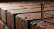 © SashaMagic - Silver dowel nail hammered into rough brick wall, offering ample copy space for design projects