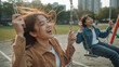 © bephoto - 公園のブランコで高さを競い笑い合う20代東アジア系男女の童心