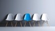 © vectyx2 - A distinct blue chair stands out in a row of white chairs against a minimalist grey wall, symbolizing individuality, leadership, and difference