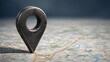 © Syawal Bangun - A large metal map pin marks a location on a detailed city map with roads and green spaces.