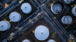 © Kalyakan - Aerial view oil storage tank and pipeline steel at night, Oil tank storage chemical petroleum petrochemical refinery product, Oil transportation system pipeline steel at oil refinery industry