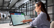 © Andrey Popov - Young Female Auditor Uses Laptop To Track