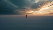 © Kanika Graphic - Solitary Figure Against Majestic Sunset Over Open Landscape