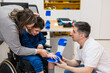 © Jordi Mora - Parents helping child with leg brace fitting
