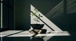 © Artfinity - Young green sprout in a black bowl on a stone pedestal. Growth and sustainability concept. Small seedling growing from dark soil in a minimalist bowl highlighted by a beam of light