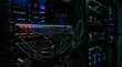© sxcd - Messy Network Cables Connected To Server Rack In Dark Data Center