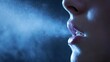 © Ytnart - A close-up of lips exhaling a cloud of vapor, surrounded by cool tones. This image evokes feelings of contemplation and serenity, capturing a moment of introspection.