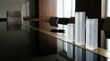 © Giggles - Frosted crystal columns on glass boardroom table with executive pen soft reflections copy space business performance growth background
