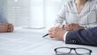 © volha_r - Business people discussing contract details during an important corporate meeting, partners reviewing legal documents with an attorney, collaborating on an agreement