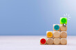 © vadish - Pyramid of wooden cubes from red to green smiley face clicked by cursor. Concept for service quality, business success, customer experience and career growth. Dissatisfied to a happy face being.
