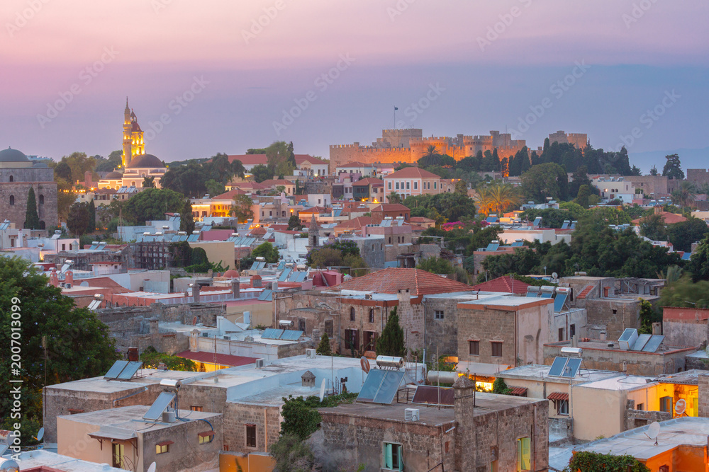 Old town skyline of Rhodes at sunset with medieval walls and historic ...