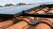 © Wisnu - Efficient solar photovoltaic panels securely mounted on a traditional tiled rooftop, illustrating sustainable home energy generation and eco-friendly technology integration