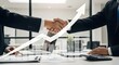 © cozycity - businessmen handshake after a good deal, office interior, modern workspace, corporate background. Business partnership meeting businessman handshake