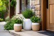 © NadenDesign - Elegant Front Door Garden Arrangement with Flower Pots and Lush Greenery in a Cozy Setting