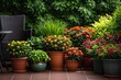 © Arfa_Media - Beautiful collection of colorful blooming flowers and potted plants arranged on tiled garden terrace with chair. High quality photo