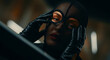 © LEFÈVRE ANTOINE JULI - Woman in black mesh balaclava and leather gloves. Cinematic portrait of model in fishnet mask. Mystery and anonymity concept for fashion editorial and crime thriller marketing visuals.