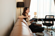 © Parichat - Young woman thinking while planning ideas from home