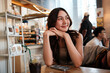 © Parichat - Young Asian woman enjoying cafe leisure moment