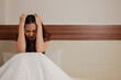 © Parichat - Woman holding head feeling stress and headache in bed