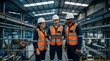 © Milan - Diverse team of industrial engineers using a tablet in a modern manufacturing plant. Factory workers in safety gear discussing production on an elevated walkway. Teamwork and technology concept