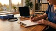 © MST - Close up of a medical professional filling out patient paperwork