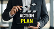 © Ridoy - Person in suit holding black clapperboard with text action plan