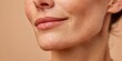 © NovaVision - Close-up macro shot of a woman's lips and jawline with subtle smile lines