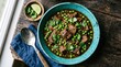 © horizon - Spicy brown curry with tender meat and green peas sits in a vibrant turquoise ceramic bowl on a dark rustic wooden table in natural light.