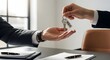 © Arman Design - business handshake exchanging house keys in modern office with natural light
