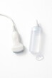 © Sarbinaz Mustafina - Medical Ultrasound Transducer Probe And Gel Bottle For Diagnostic Sonography, Obstetrics Radiology And Pregnancy Healthcare Clinical Equipment Technology, Isolated On White Background