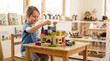 © Xenia - Smiling young girl building a colorful wooden block castle at a classroom table. Happy preschool student engaged in creative play. Early childhood education and development concept