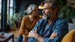 © Julia - Middle aged couple in couples therapy with man leaning back with crossed arms as he slowly uncurls one hand while his wife reaches in a tense therapy room showing connection