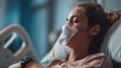 © Fluffik - Patient woman with ventilator mask on hospital bed during medical treatment at healthcare facility