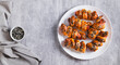 © elenarui - Homemade sausages in sesame dough on a plate on the table top view web banner